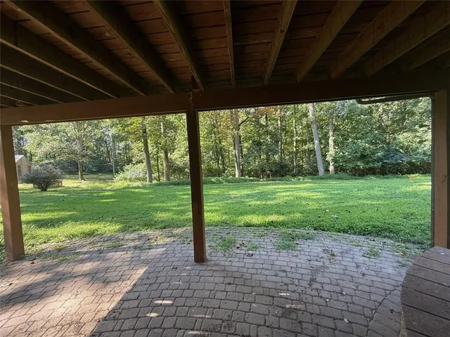 a backyard of a house with lots of green space