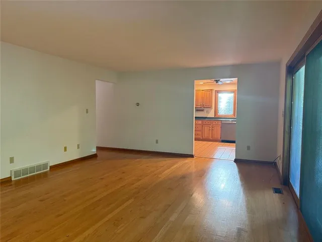 a kitchen with a sink a stove top oven and cabinets