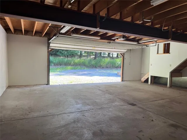 a view of a room with wooden floor and cabinet