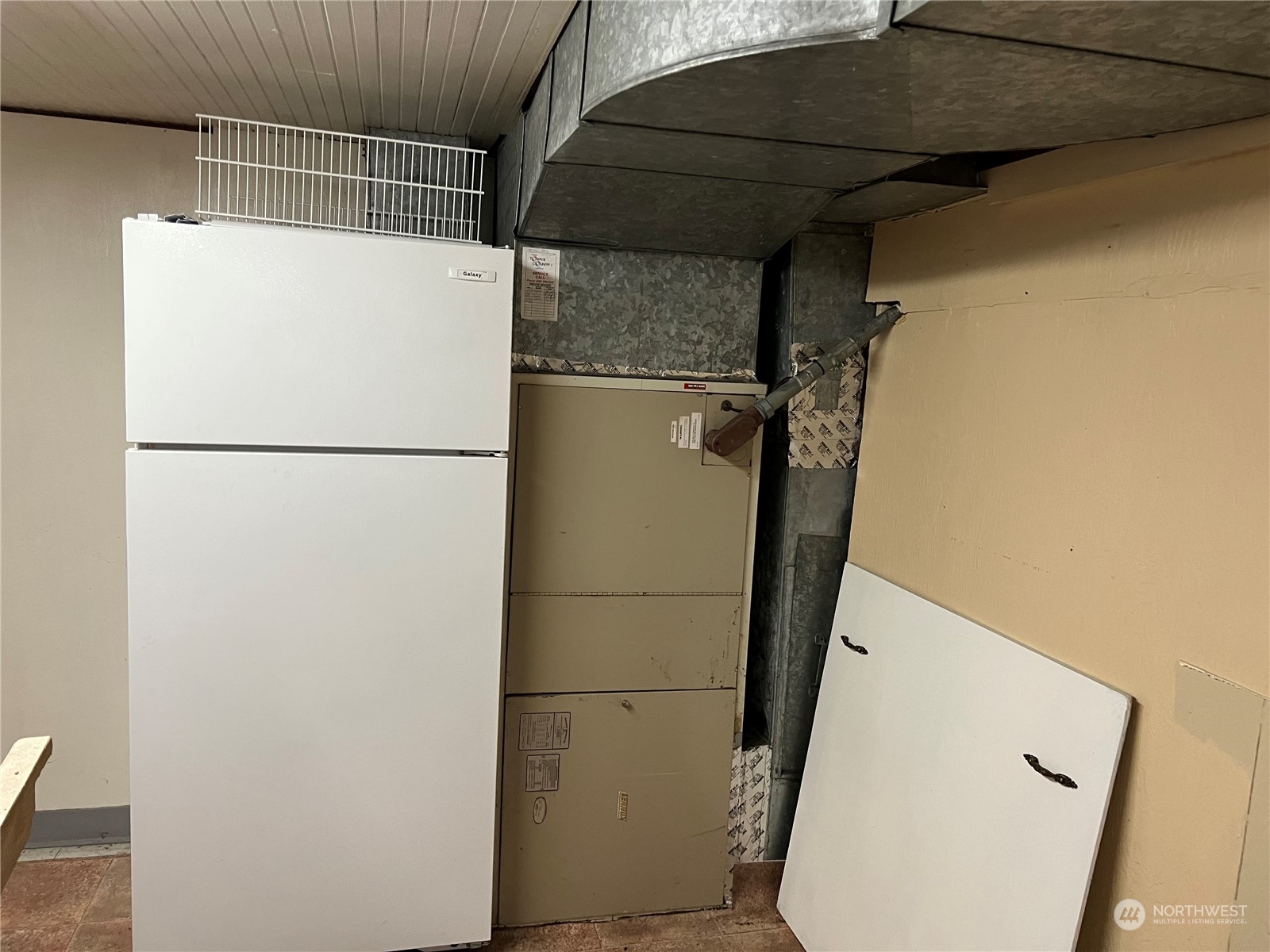 3803 Northeast 199th Street Ridgefield, WA 98642 - Photo 13 of 22 a white refrigerator freezer and a microwave oven in a small kitchen