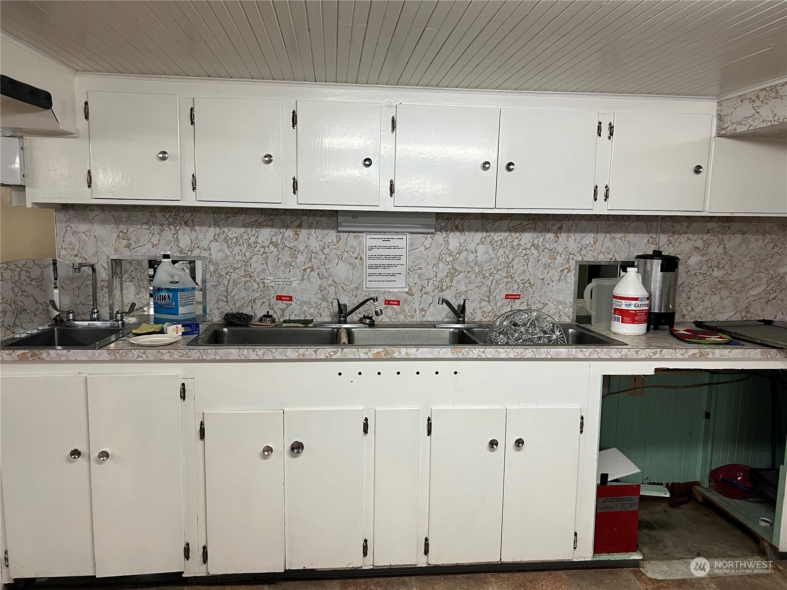 3803 Northeast 199th Street Ridgefield, WA 98642 - Photo 9 of 22 a kitchen with white cabinets and a potted plant