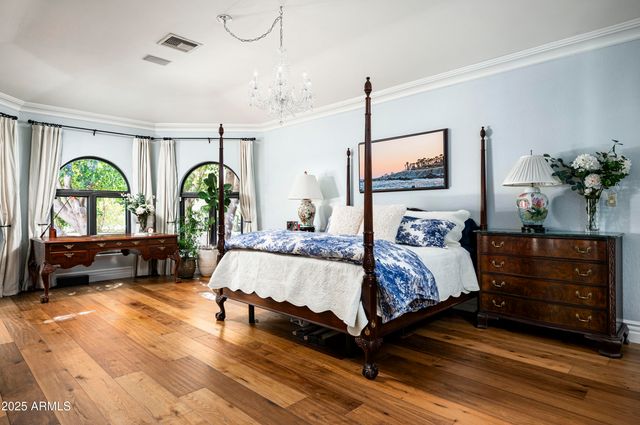 a spacious bathroom with a granite countertop sink mirror and shower