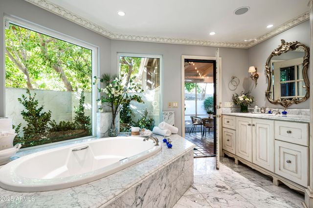 a bedroom with a bed window and fireplace