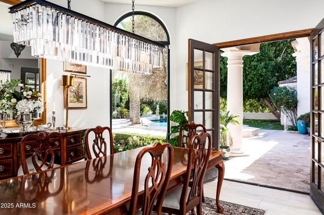 an aerial view of a house with a garden and lake view