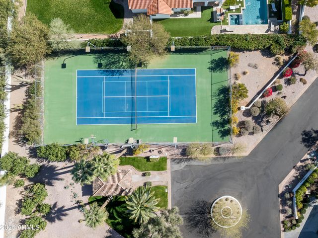 a living room with furniture a rug and a window