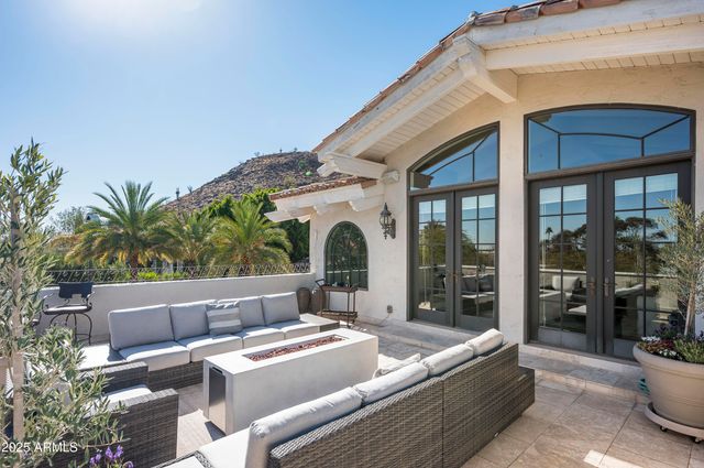 a bathroom with a granite countertop sink a toilet and mirror