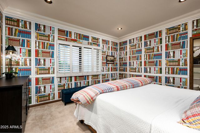 a bedroom with a bed and a night stand