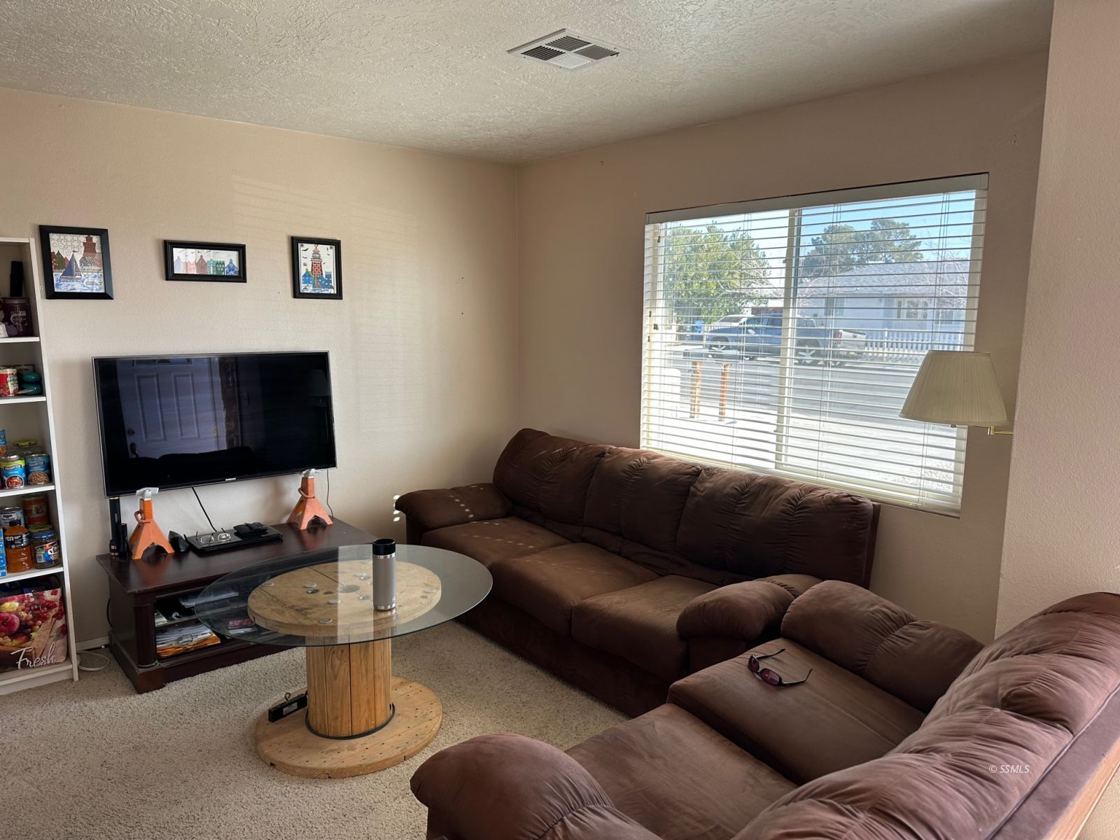 237 South Desert Candles Street Ridgecrest, CA 93555 - Photo 3 of 23 a living room with furniture and a flat screen tv