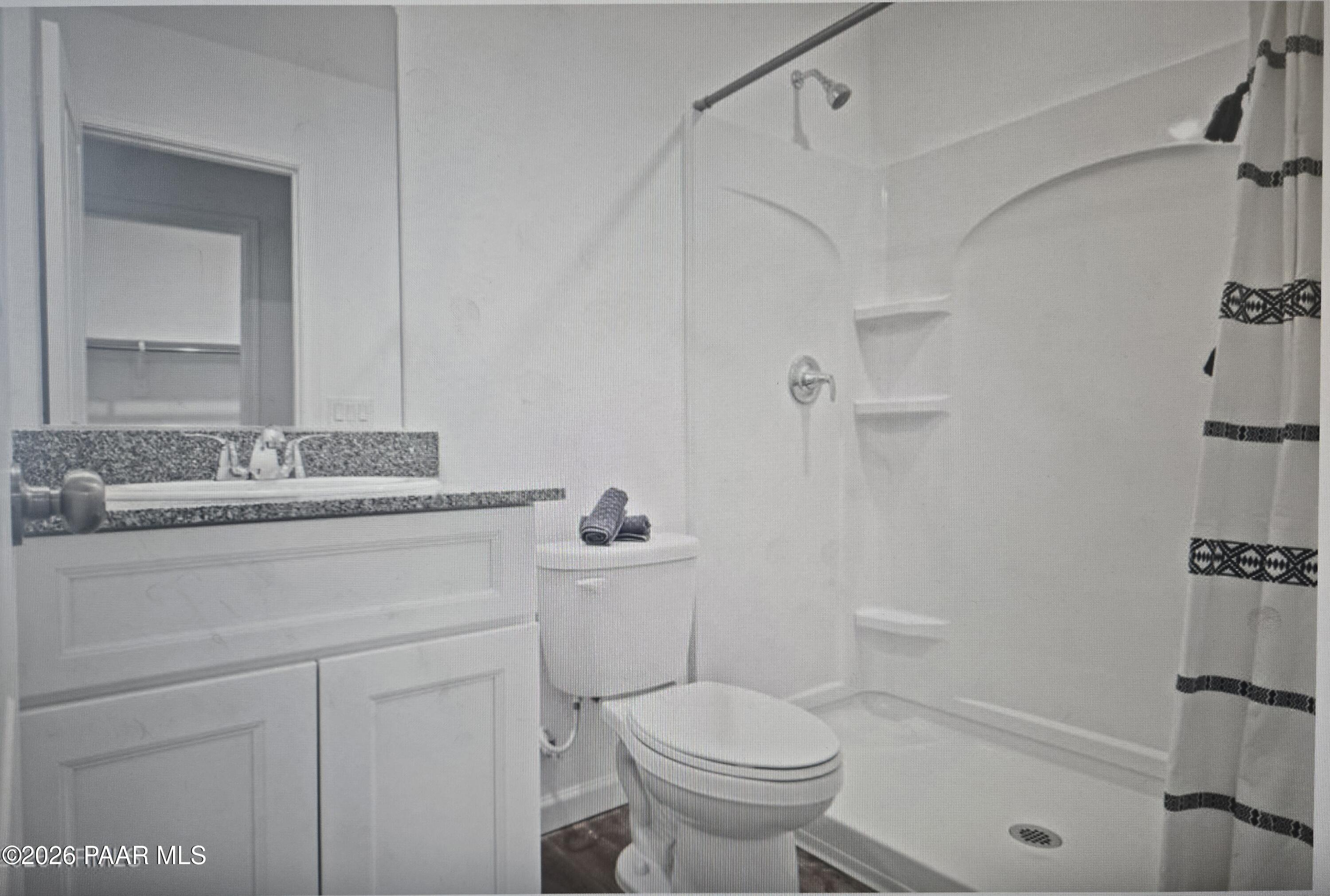 20182 East Lakeside Road Cordes Lakes, AZ 86333 - Photo 14 of 20 a bathroom with a sink toilet vanity and shower