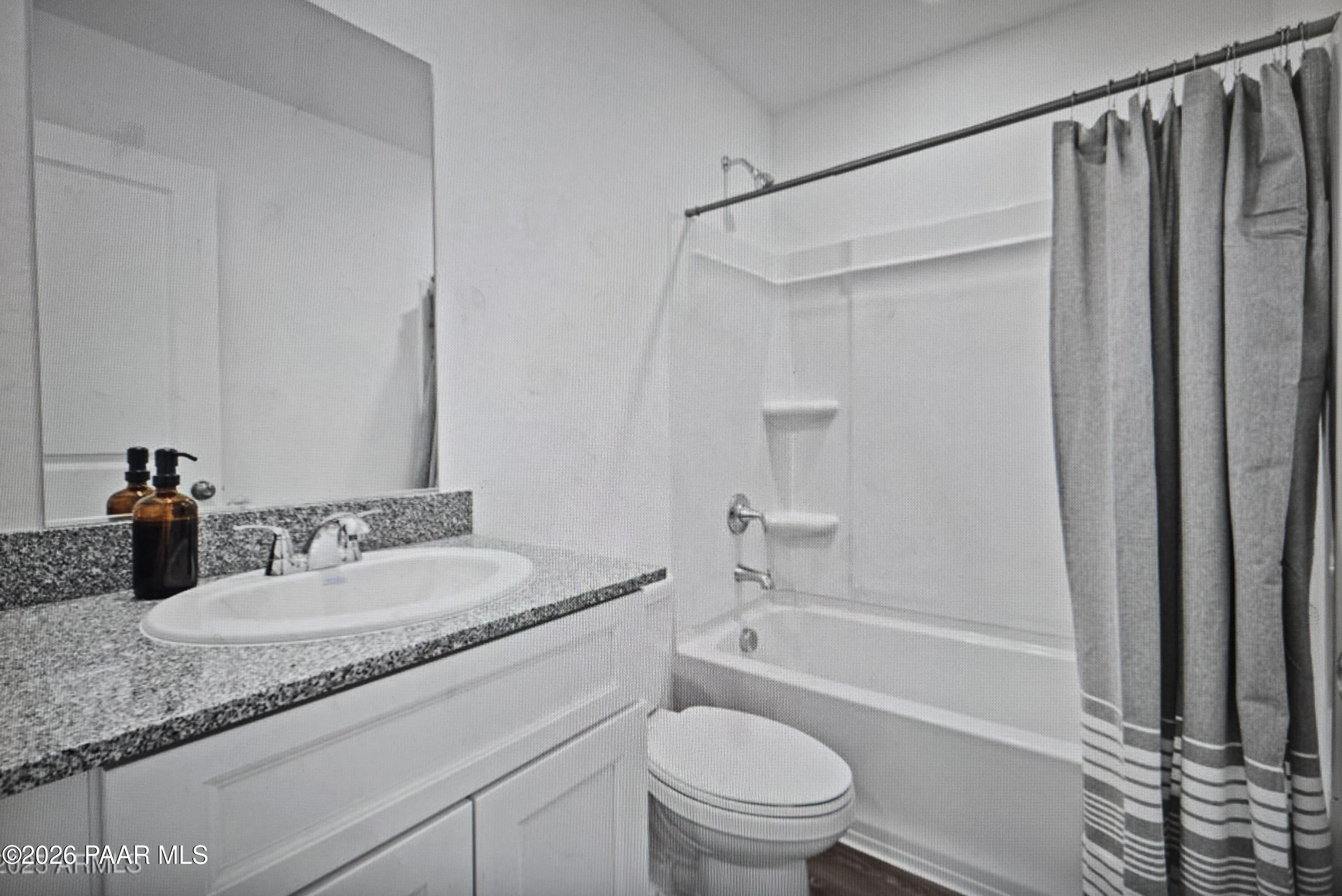 20182 East Lakeside Road Cordes Lakes, AZ 86333 - Photo 15 of 20 a bathroom with a granite countertop sink toilet and shower