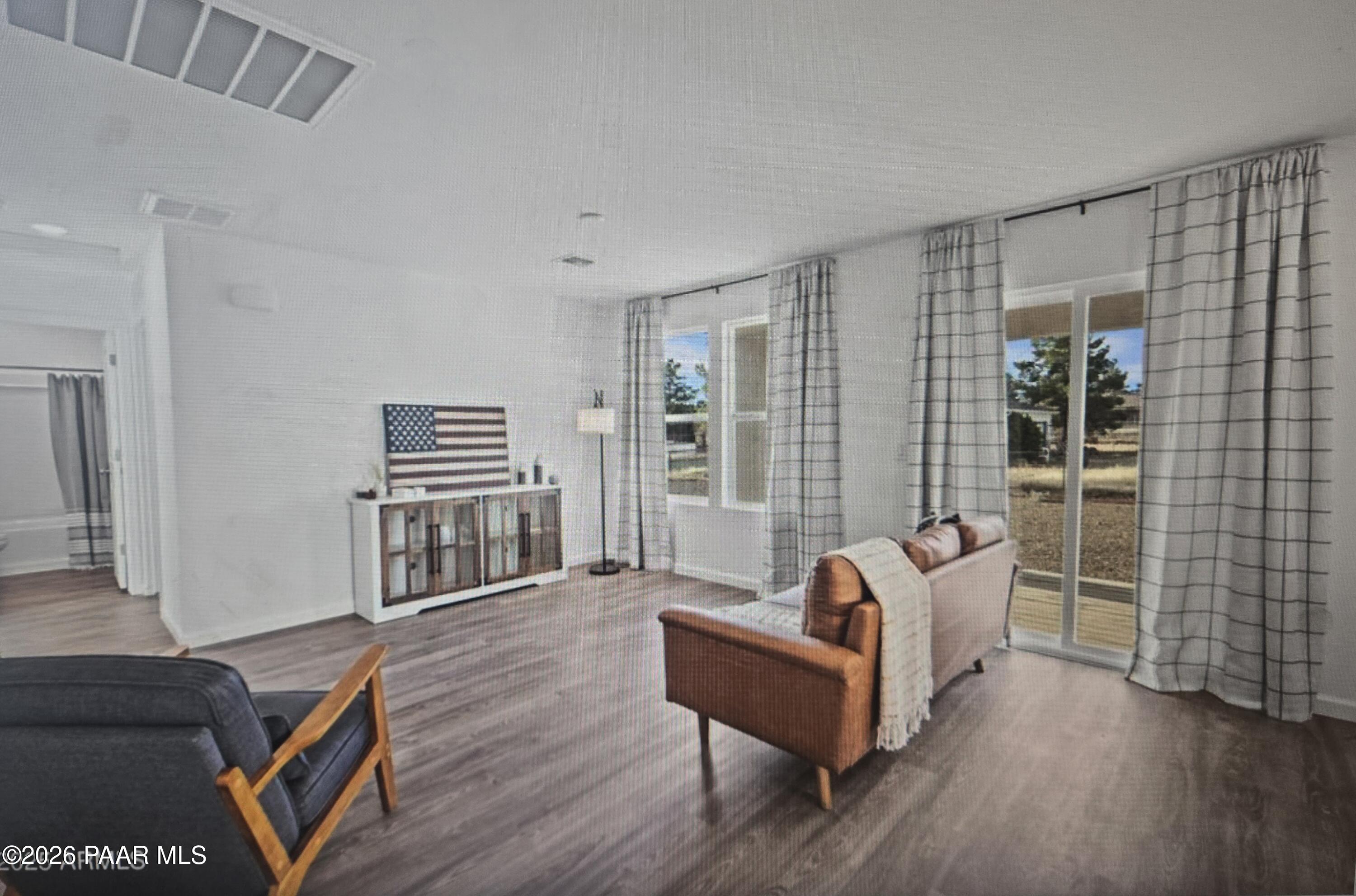 20182 East Lakeside Road Cordes Lakes, AZ 86333 - Photo 6 of 20 a living room with furniture and a wooden floor