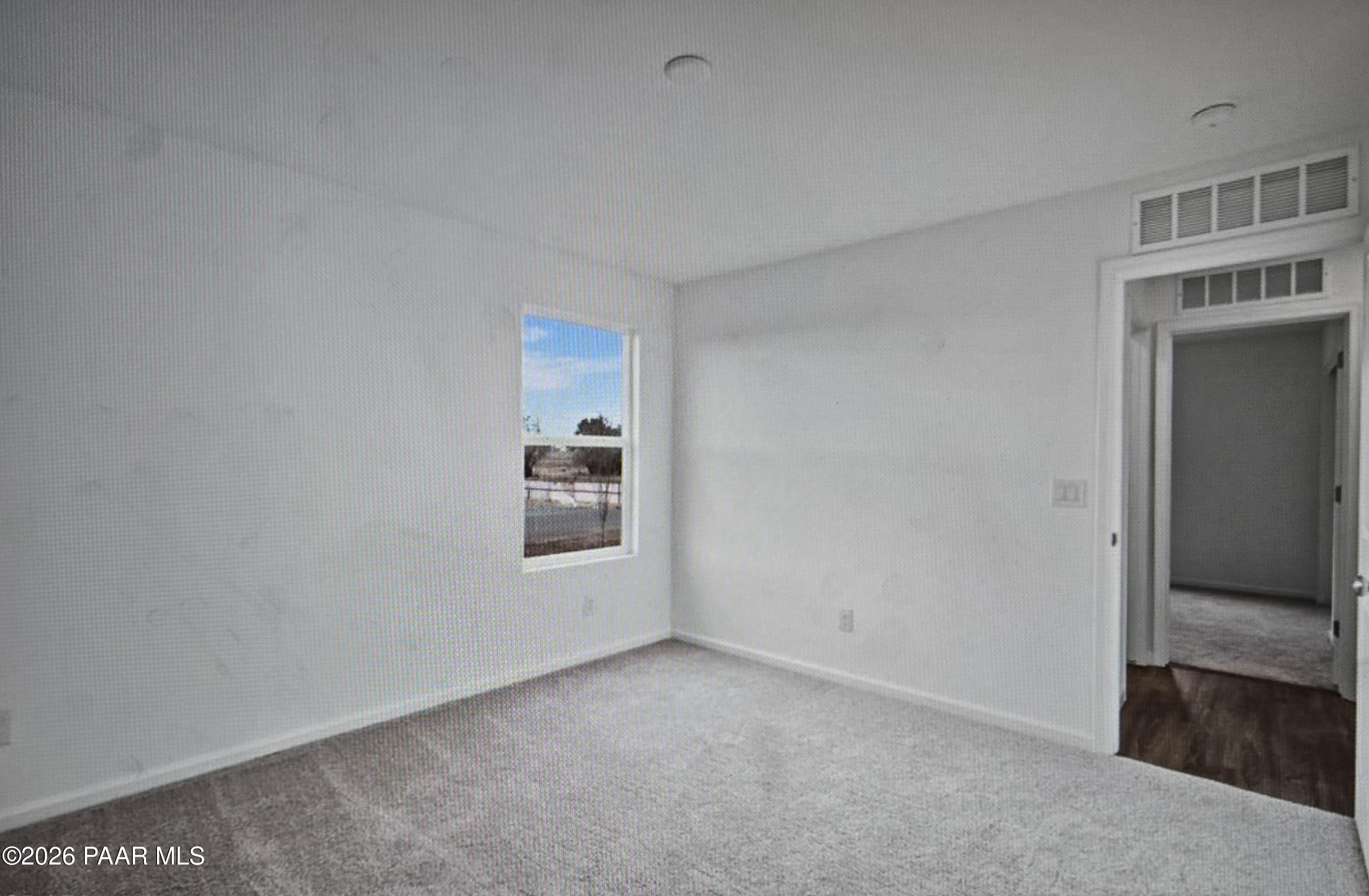 20182 East Lakeside Road Cordes Lakes, AZ 86333 - Photo 8 of 20 a view of empty room with wooden floor and fan