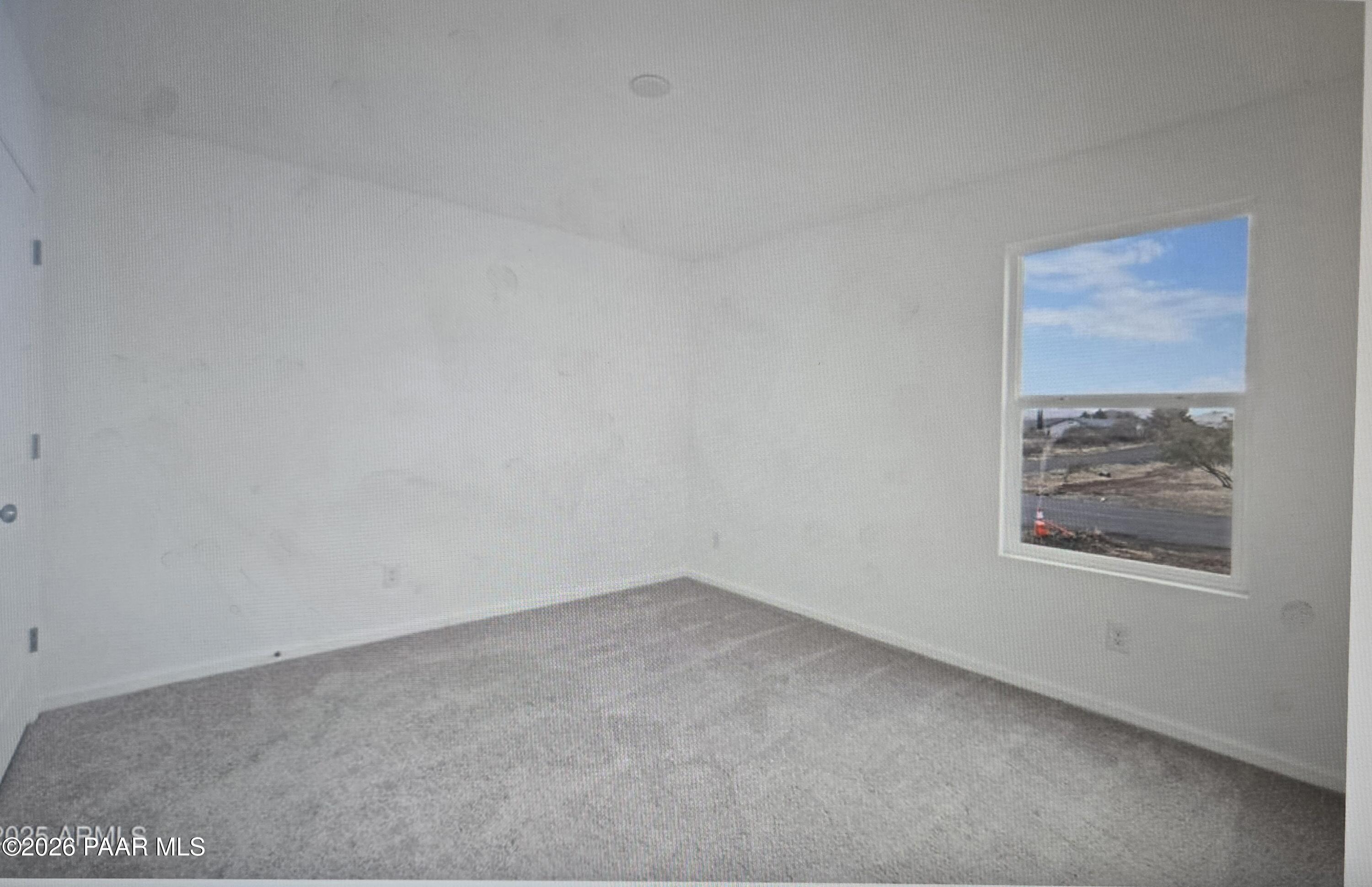 20182 East Lakeside Road Cordes Lakes, AZ 86333 - Photo 10 of 20 an empty room with a window