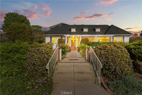 a view of a pathway in front of house