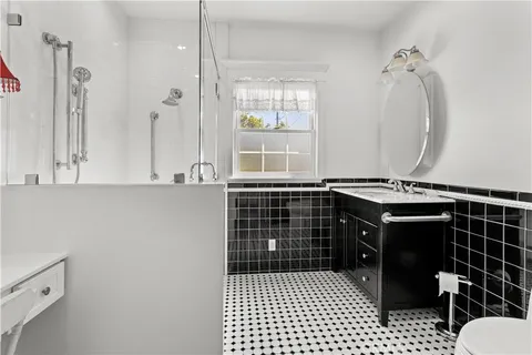 a bathroom with a sink a vanity and a mirror
