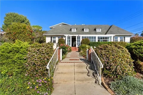 a view of a house with brick walls