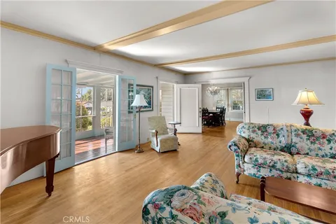 a bedroom with bed and wooden floor
