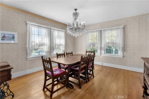 a view of a dining room with furniture and window