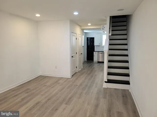 an empty room with wooden floor