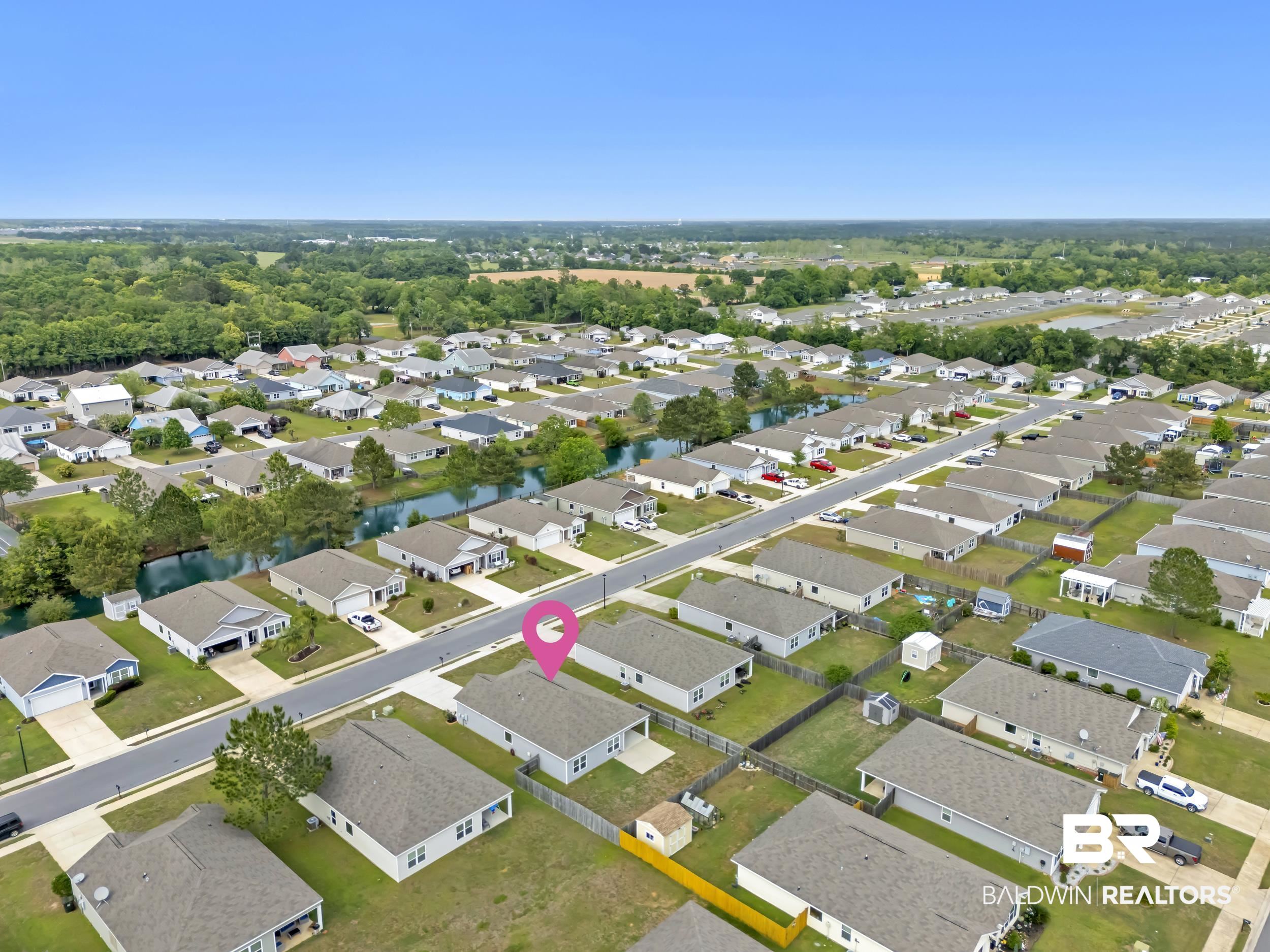 17344 Harding Drive Foley, AL 36535 - Photo 43 of 46 Aerial perspective of a residential community featuring single-story homes with individual driveways and fenced backyards