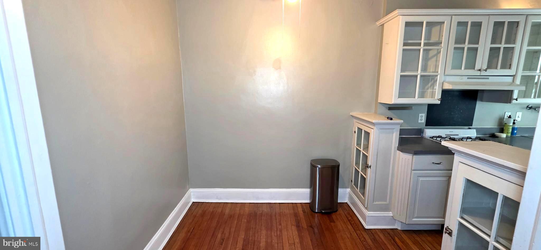 1954 Columbia Road Northwest, Unit 104 Washington, DC 20009 - Photo 11 of 18 a view of a storage & utility room with wooden floor