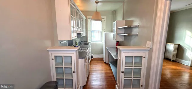 a kitchen with a stove and a refrigerator