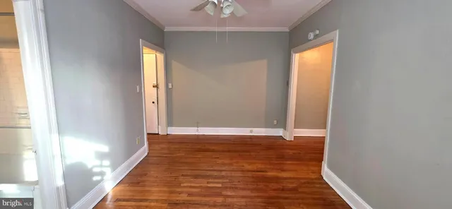 a view of front door with wooden floor