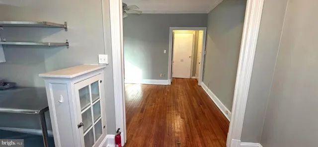 a view of a storage & utility room with wooden floor