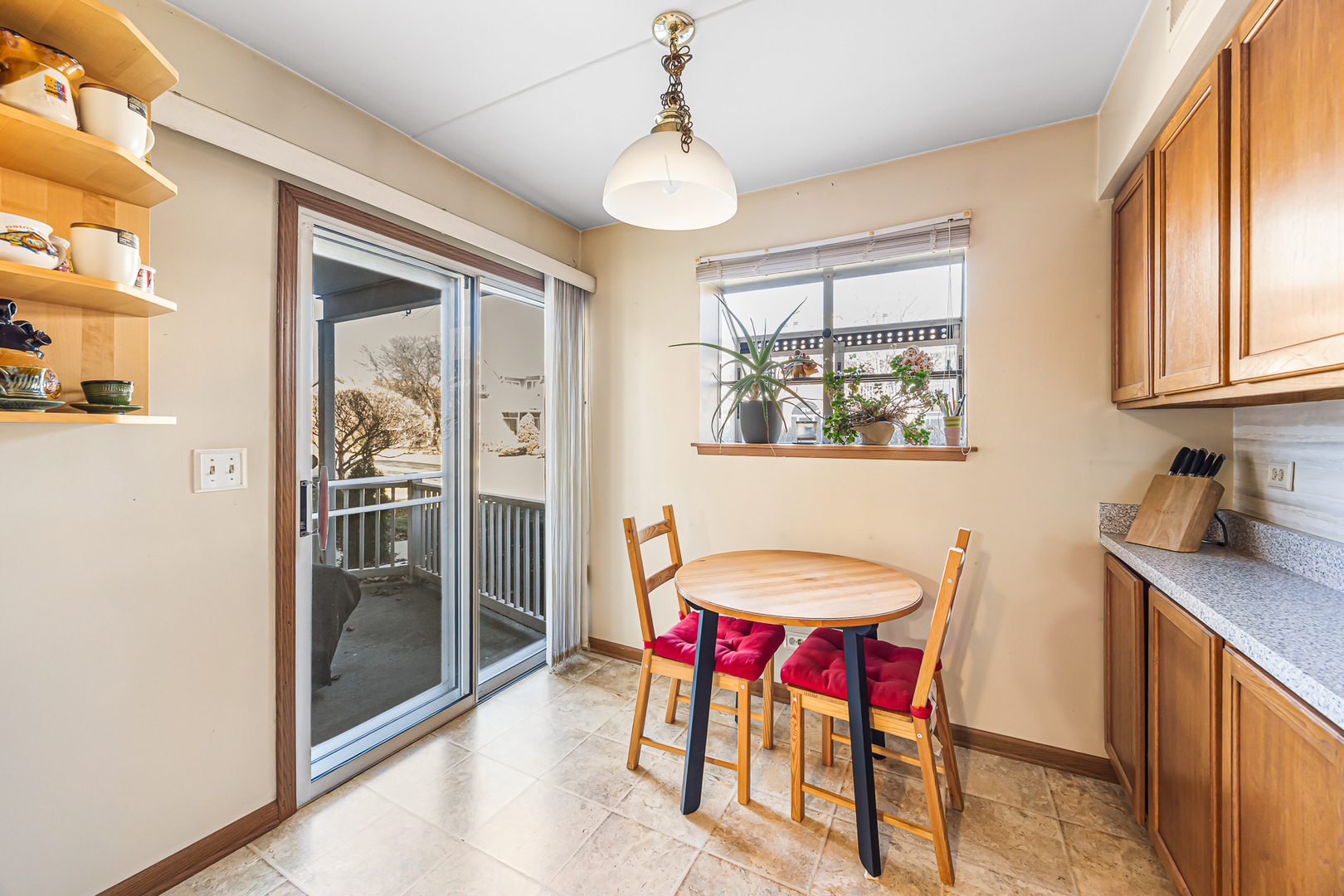 1226 Chalet Road, Unit 2102 Naperville, IL 60563 - Photo 9 of 28 a view of a dining room with furniture and a window