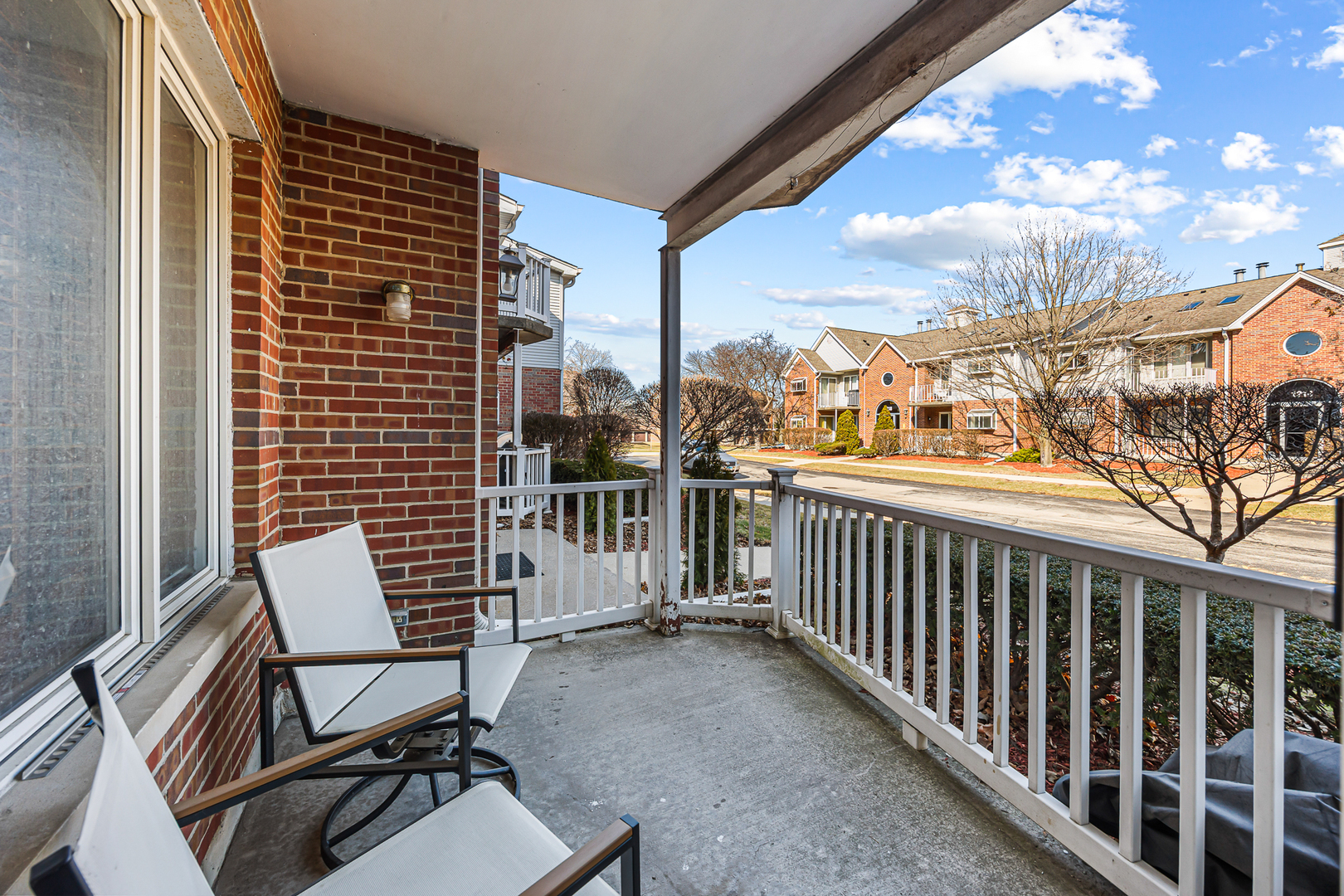 1226 Chalet Road, Unit 2102 Naperville, IL 60563 - Photo 10 of 28 a view of a balcony with chair