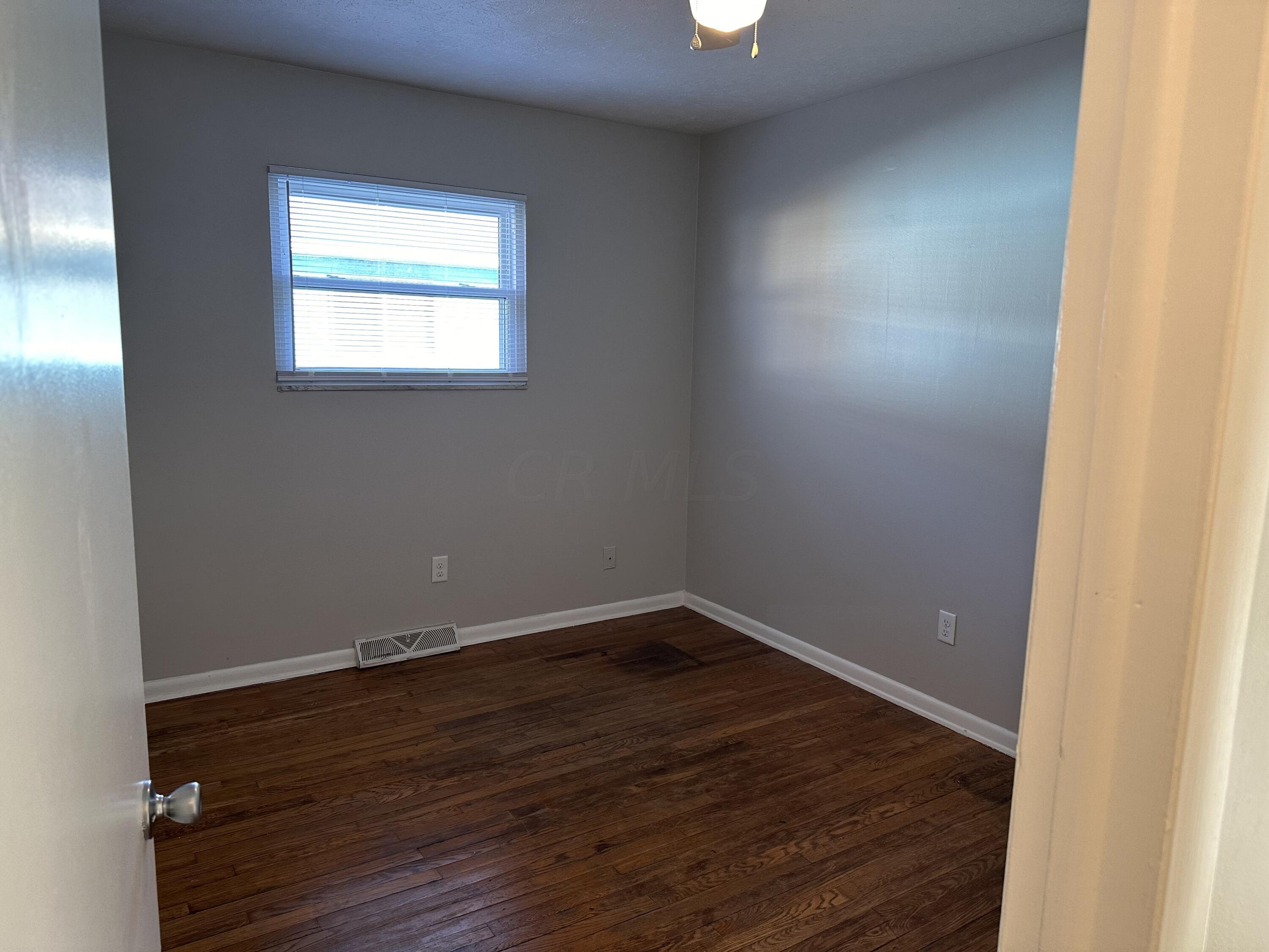 4770-4774 Etna Road Whitehall, OH 43213 - Photo 9 of 19 One of three bedrooms with overhead lighting and hardwood flooring.
