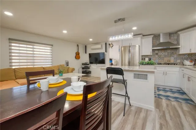 a kitchen with a sink appliances and cabinets