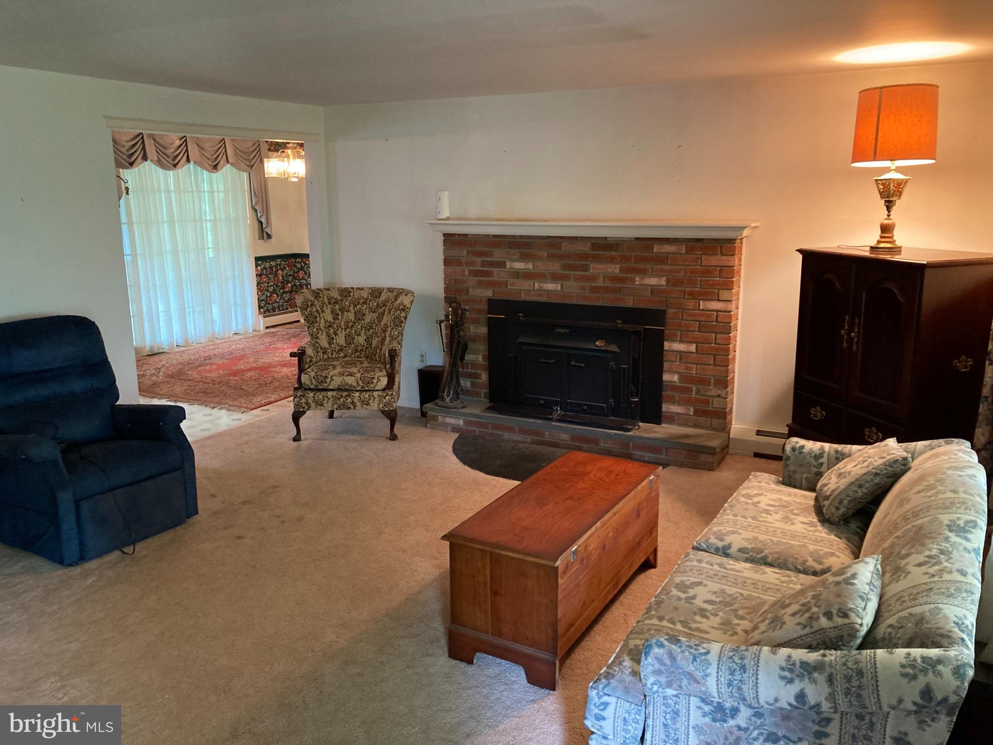 580 Jacksonville Road Warminster, PA 18974 - Photo 5 of 20 a living room with furniture and a fireplace