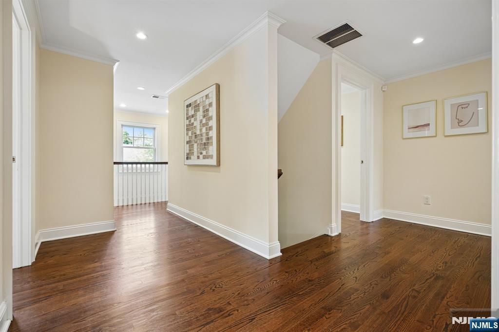 11 Mt Vernon Road Montclair, NJ 07043 - Photo 20 of 49 an empty room with wooden floor cabinet and windows