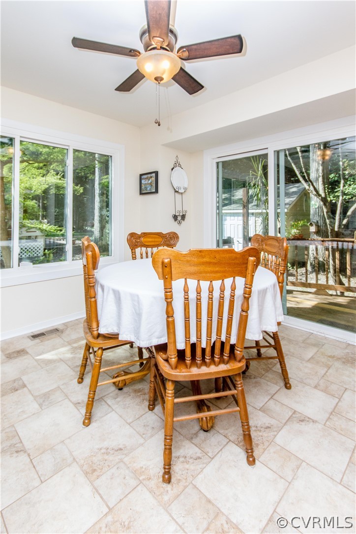 13712 Sandy Oak Road Chester, VA 23831 - Photo 13 of 36 a view of a dining room with furniture window and outside view