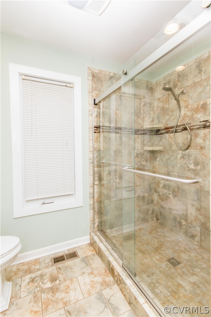 13712 Sandy Oak Road Chester, VA 23831 - Photo 20 of 36 a bathroom with a shower