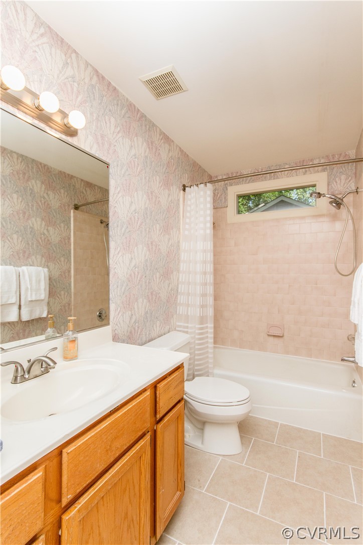 13712 Sandy Oak Road Chester, VA 23831 - Photo 29 of 36 a bathroom with a sink a toilet and shower