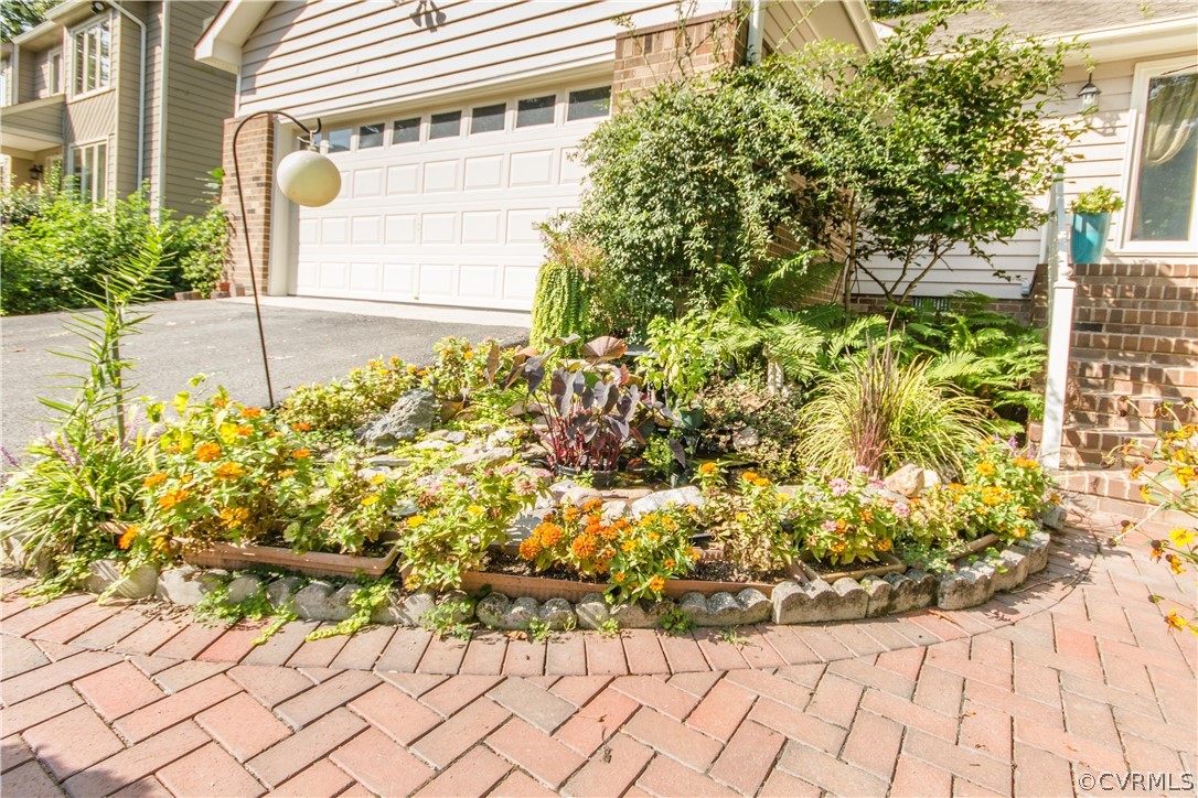 13712 Sandy Oak Road Chester, VA 23831 - Photo 3 of 36 a view of a garden