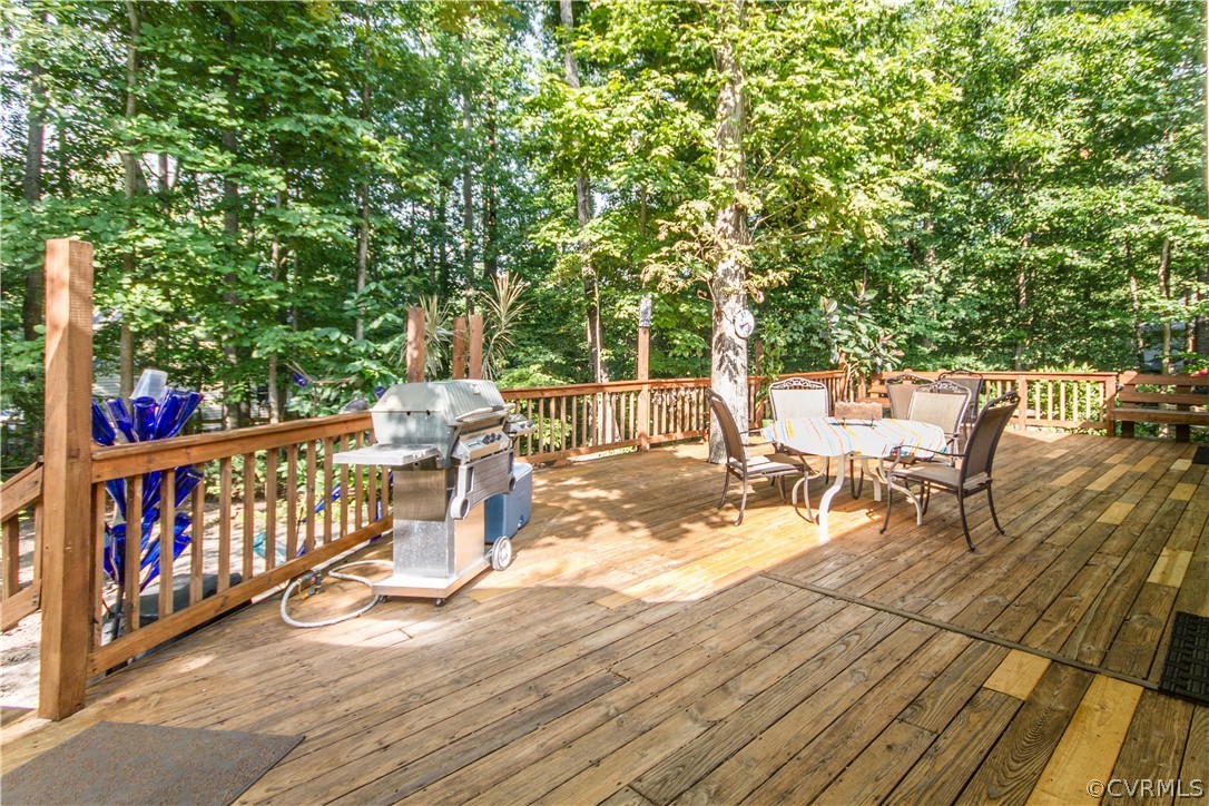 13712 Sandy Oak Road Chester, VA 23831 - Photo 34 of 36 a view of a chairs and table on the wooden floor