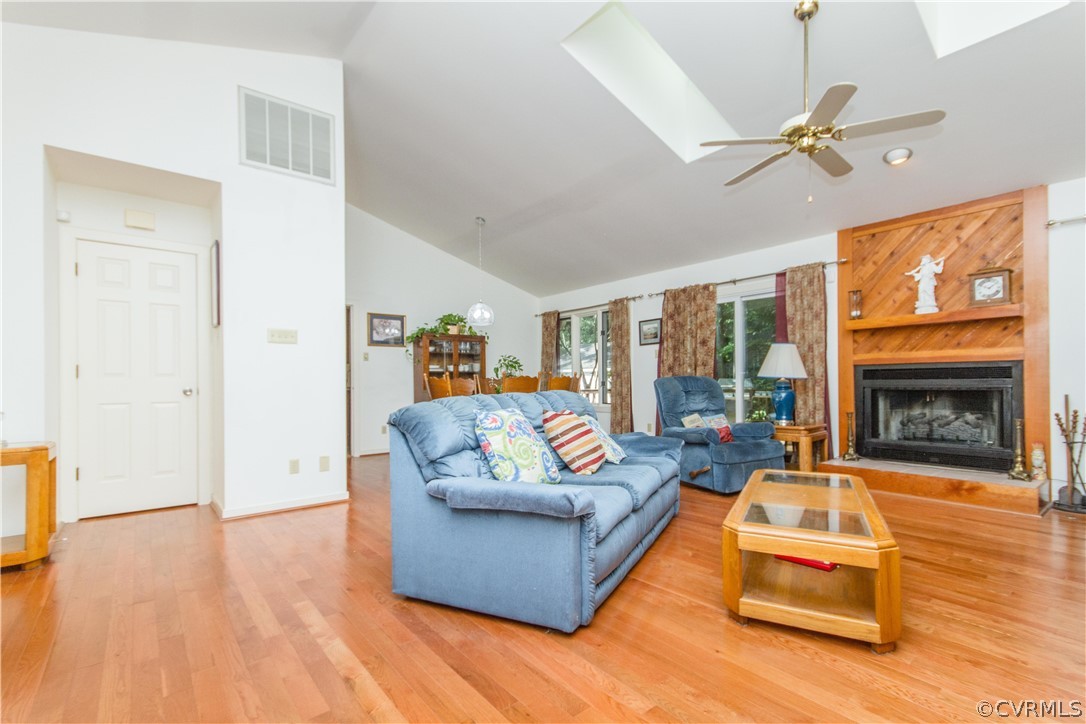13712 Sandy Oak Road Chester, VA 23831 - Photo 4 of 36 a living room with furniture and a fireplace