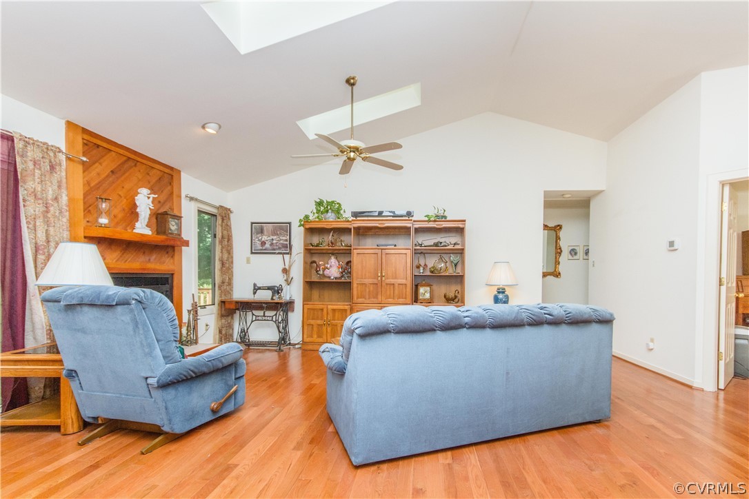 13712 Sandy Oak Road Chester, VA 23831 - Photo 8 of 36 a living room with furniture and a large window