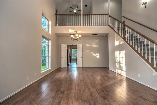 a view of an entryway with wooden floor