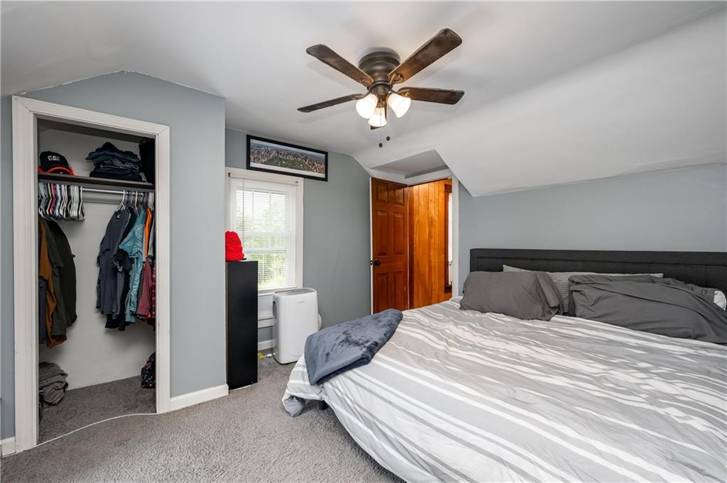5440 Pittsburgh Road Harrisville, PA 16038 - Photo 11 of 16 a bedroom with a bed and a ceiling fan