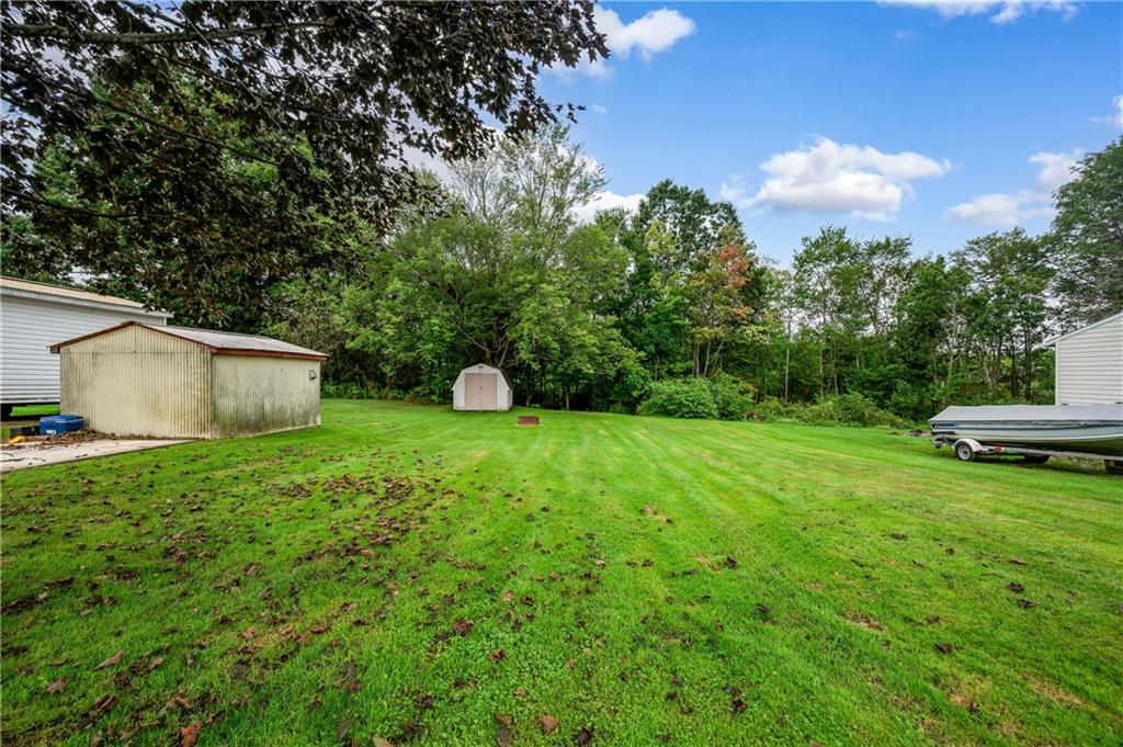 5440 Pittsburgh Road Harrisville, PA 16038 - Photo 16 of 16 a view of a backyard with sitting area