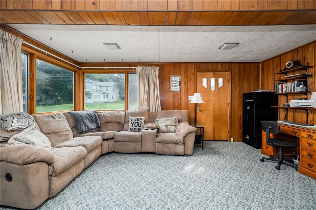 5440 Pittsburgh Road Harrisville, PA 16038 - Photo 10 of 16 a living room with furniture and a flat screen tv