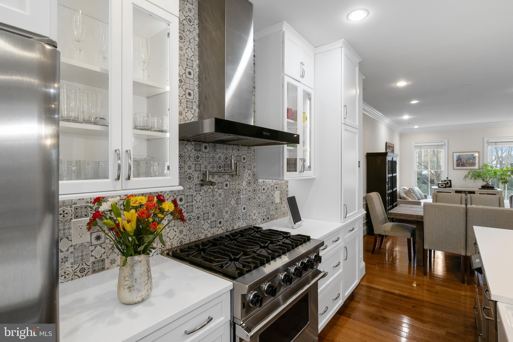 419 Princess Street Alexandria, VA 22314 - Photo 13 of 44 a kitchen with stainless steel appliances granite countertop a stove a sink and a refrigerator
