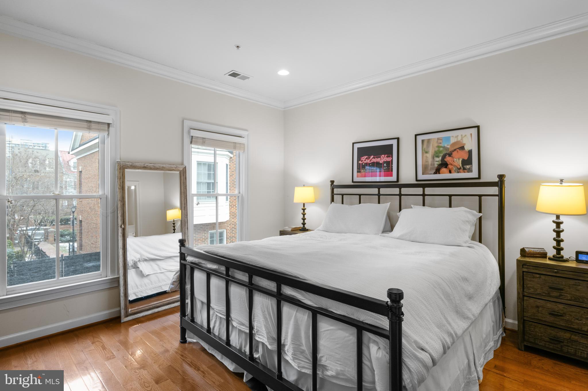 419 Princess Street Alexandria, VA 22314 - Photo 15 of 44 a bedroom with a bed a dresser and next to a window