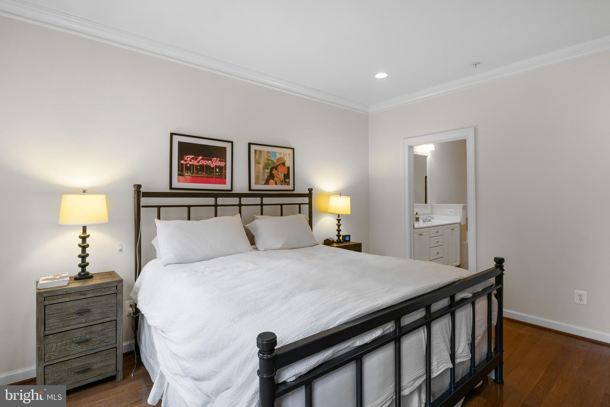 419 Princess Street Alexandria, VA 22314 - Photo 16 of 44 a bedroom with a bed and a chandelier