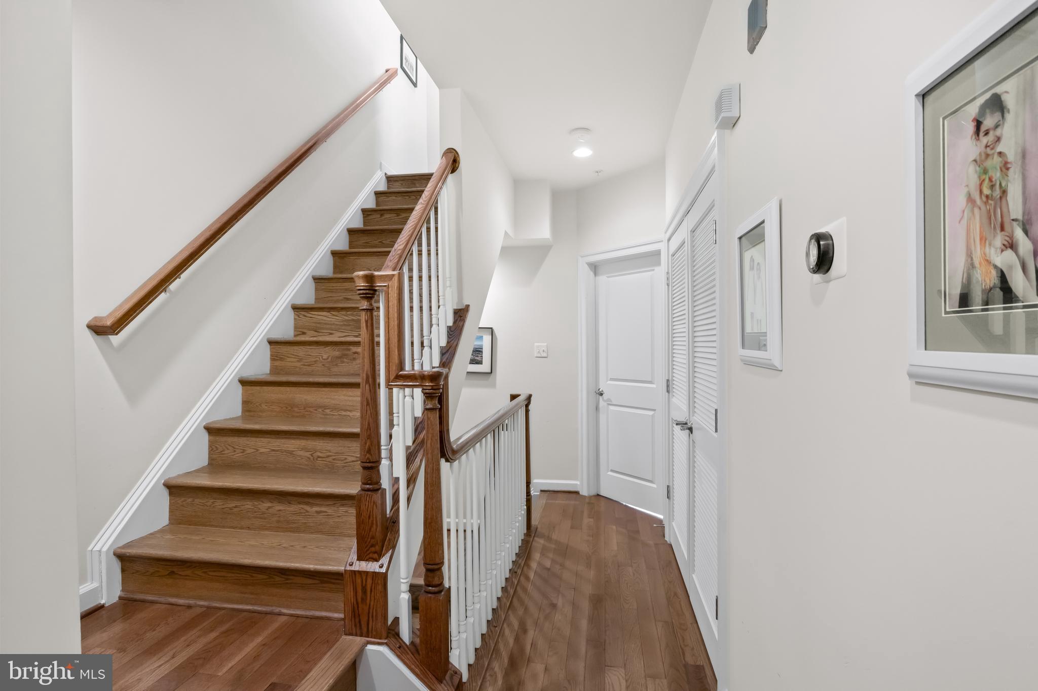 419 Princess Street Alexandria, VA 22314 - Photo 24 of 44 a view of entryway with wooden floor and stairs