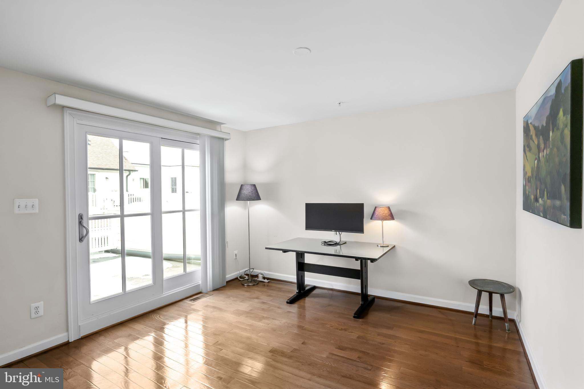 419 Princess Street Alexandria, VA 22314 - Photo 27 of 44 a view of a livingroom with workspace and a window